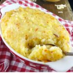 mashed potato pie in a red checked dish on a red checked cloth