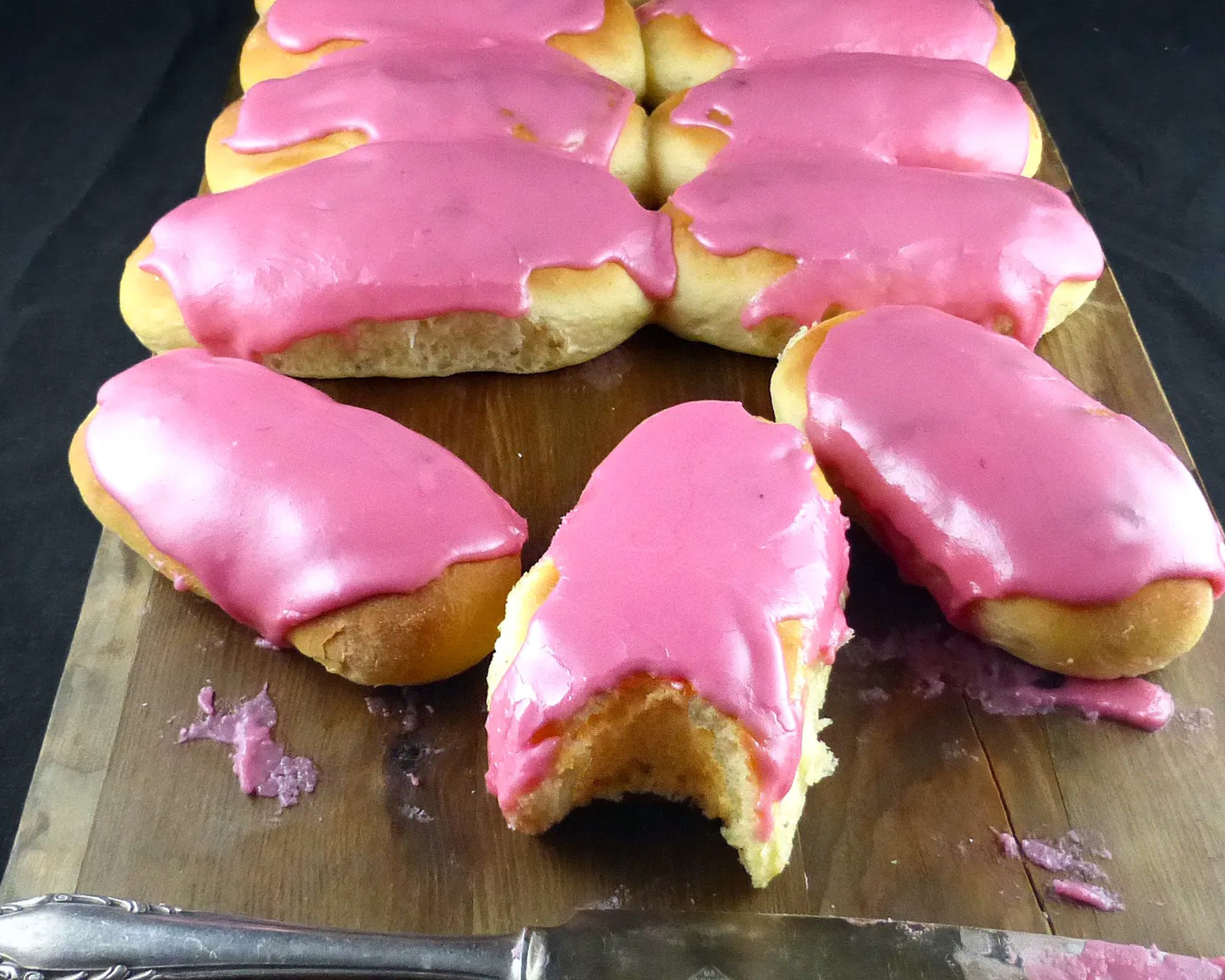 sweet finger buns topped with pink icing