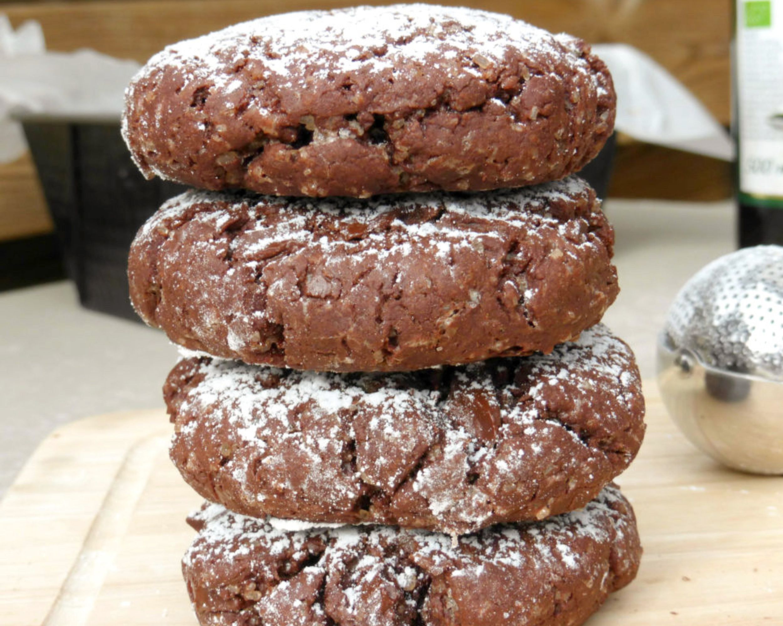 four chocolate cookies stacked on top of each other