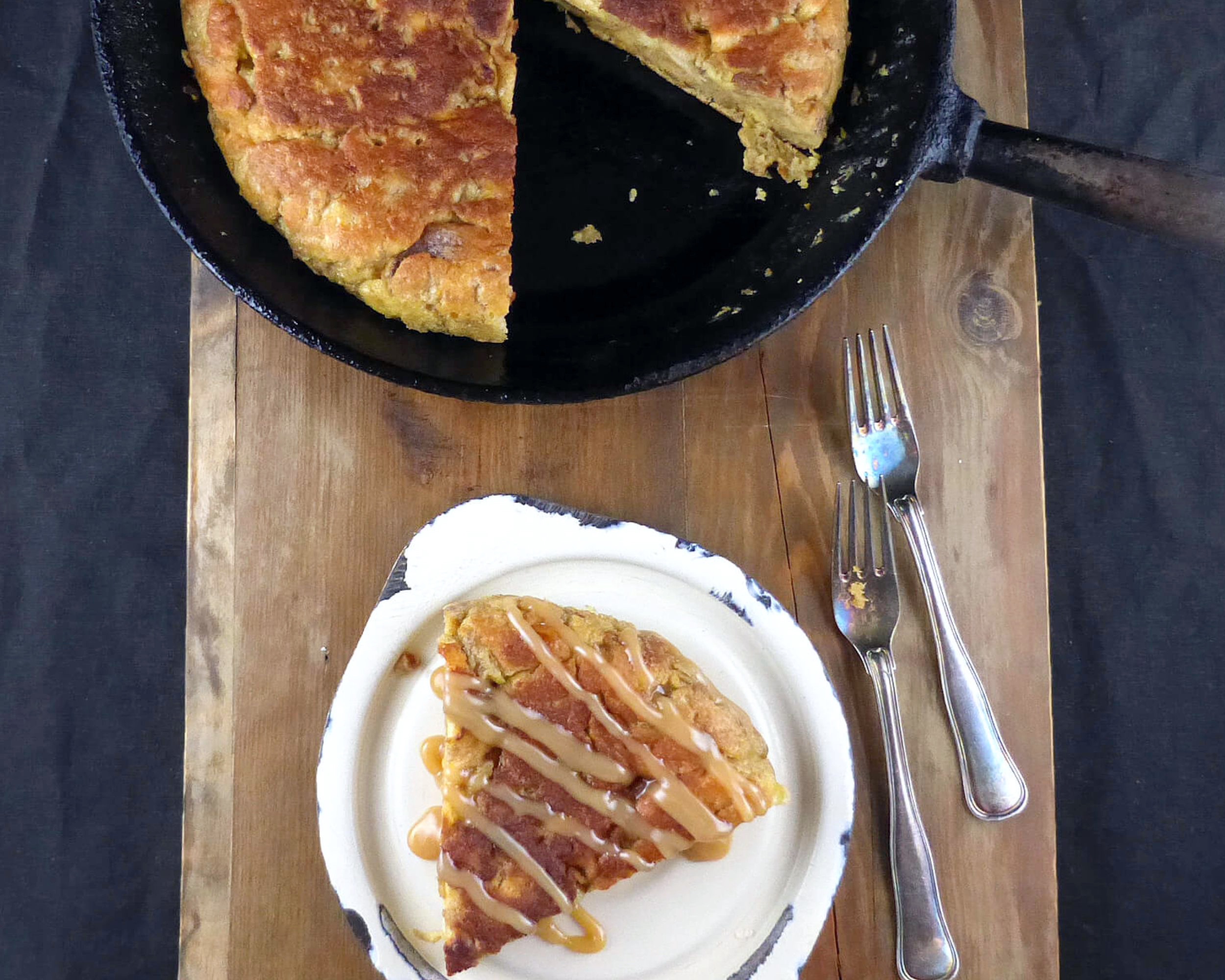 eggy bread with a slice cut on a wooden board