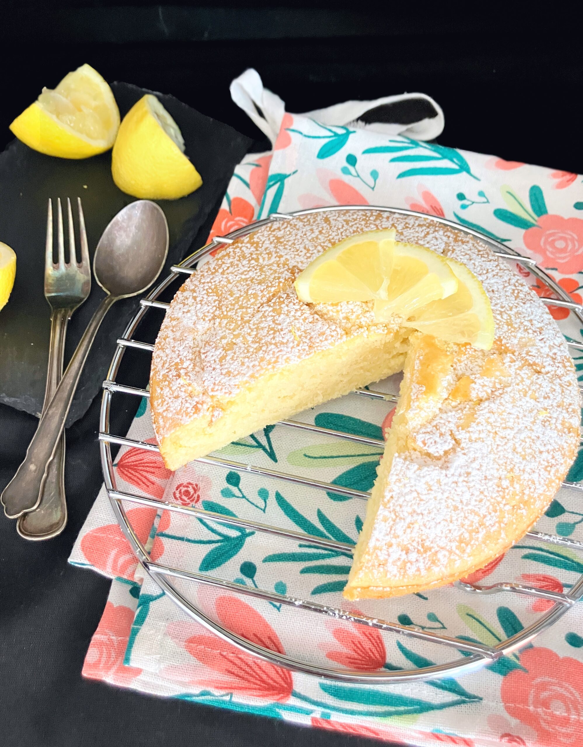 https://www.thespeltkitchen.com/wp-content/uploads/2023/07/Spelt-AirFryer-Lemon-Cake-with-a-piece-missing-scaled.jpg