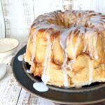 monkey bread on a brown plate with drizzle